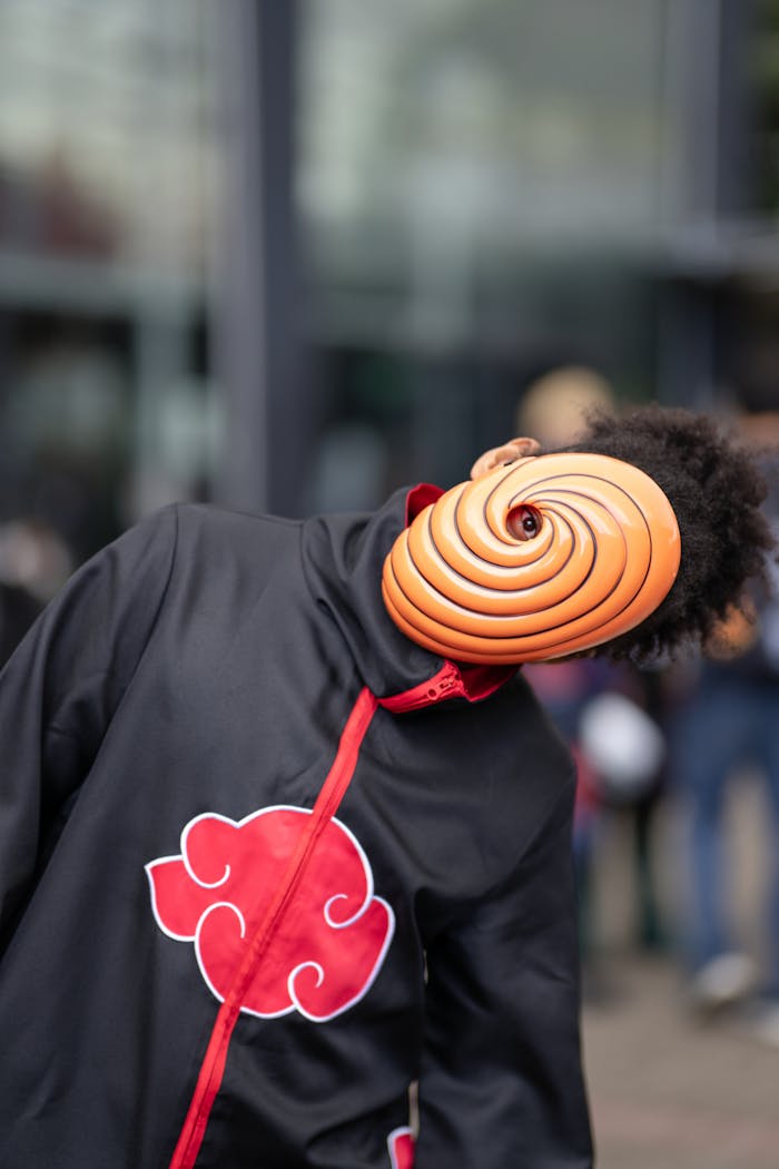 Anime cosplay featuring iconic masked character at a San José convention.